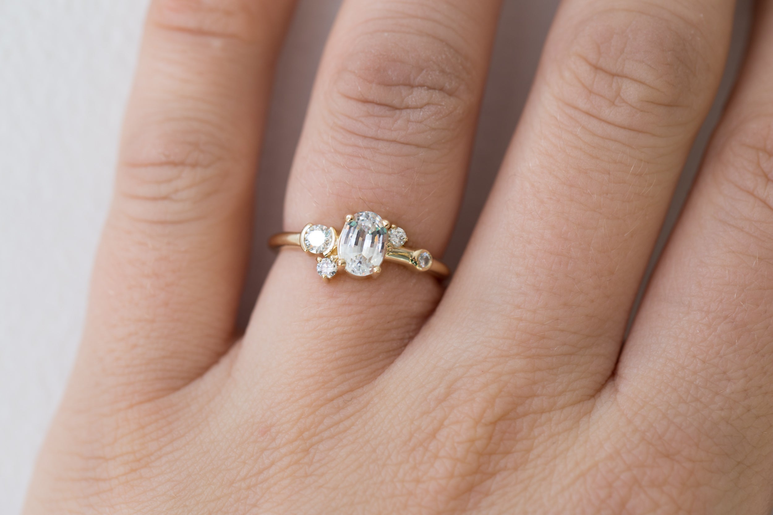 Mae Ring | Oval White Sapphire + Diamond Cluster Ring | 14k Recycled Gold