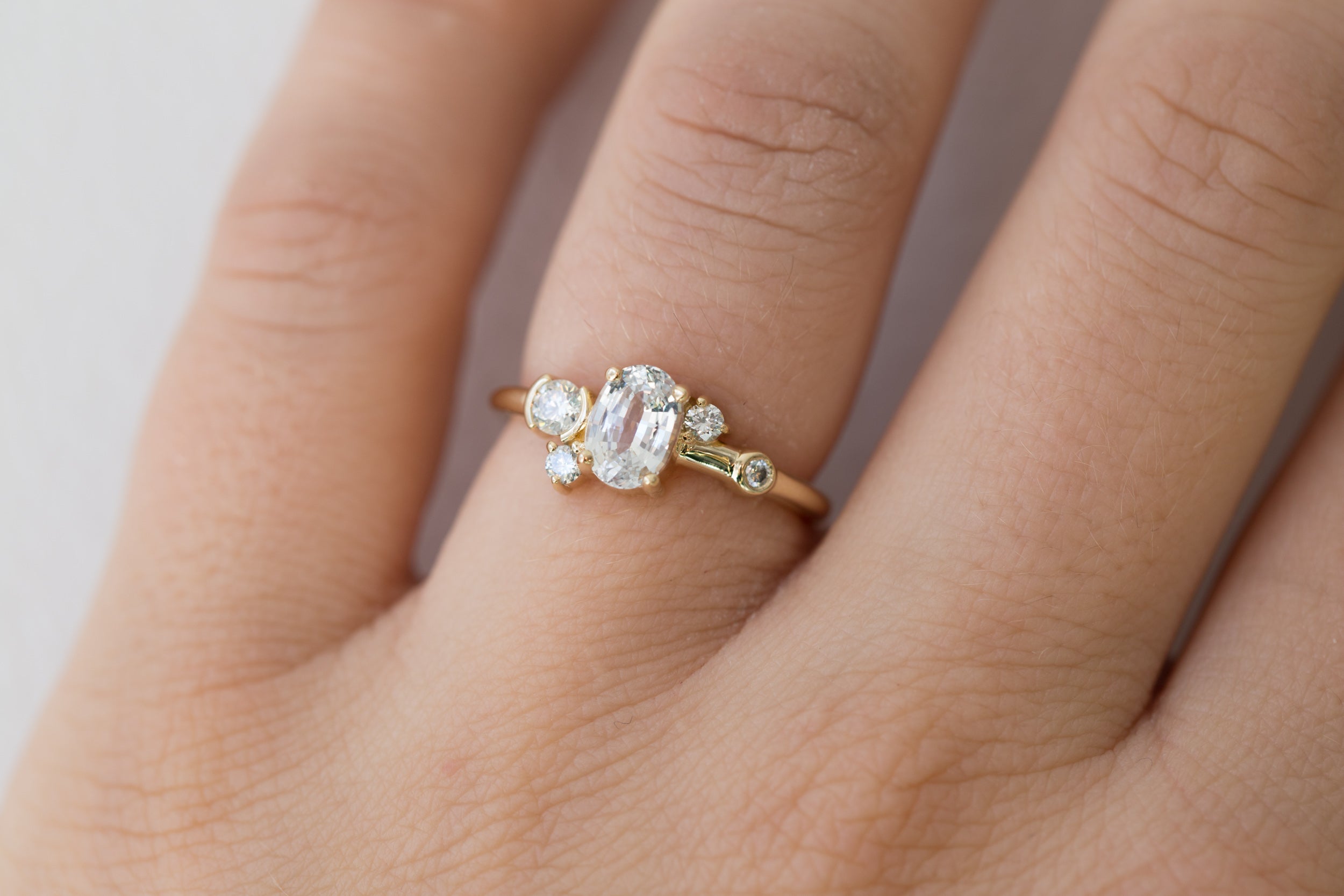 Mae Ring | Oval White Sapphire + Diamond Cluster Ring | 14k Recycled Gold