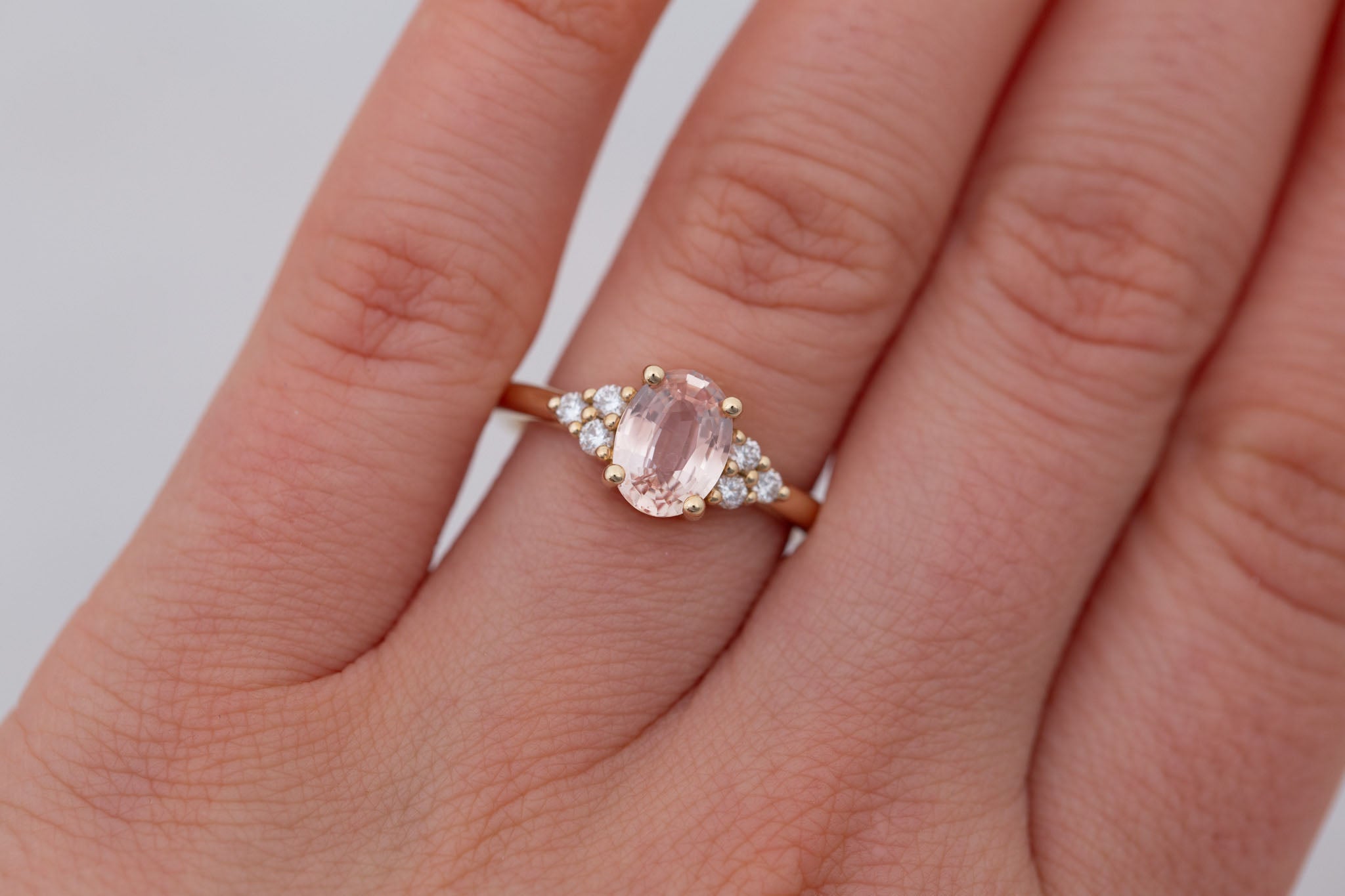 Verona Ring | Peach Oval Sapphire + Round Diamond Accents Engagement Ring 1.68 ct | 14k Recycled Gold | One of a Kind
