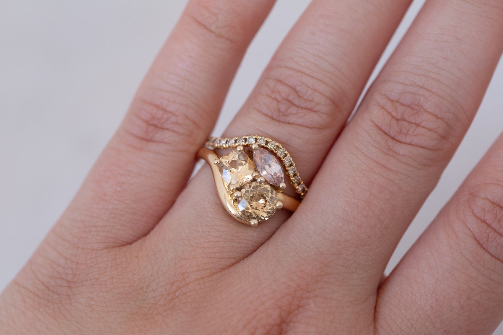 Valeria Ring | Apricot + Blush Sapphire Curved Band Engagement Ring | 14k Recycled Gold | One of a Kind