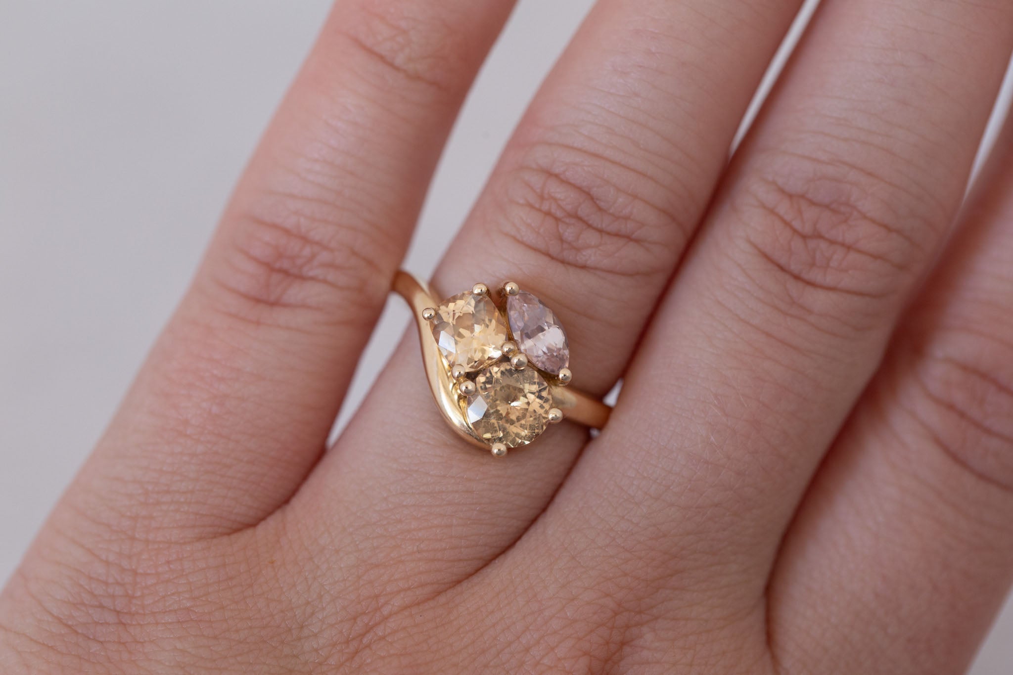 Valeria Ring | Apricot + Blush Sapphire Curved Band Engagement Ring | 14k Recycled Gold | One of a Kind